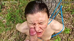 Tied brunette screams mouth fucked hard against forest tree