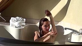 cute asian 18yo teases in hot tub with fingering machine play