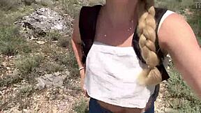 Cute college blonde strips naked in jungle showing natural tits and ass