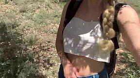 Cute college blonde strips naked in jungle showing natural tits and ass