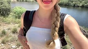 Cute college blonde strips naked in jungle showing natural tits and ass