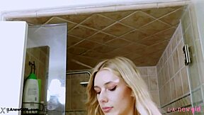 elegant blonde teen steps into shower after classy photoshoot interview