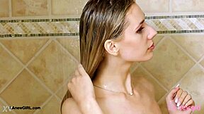 elegant blonde teen steps into shower after classy photoshoot interview