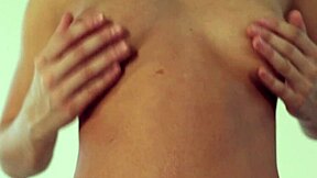 wanna watch this cute brunette teen grope her tits in the mirror?