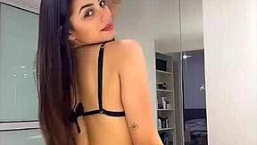 a hot young woman crams bikini deep into her big ass cheeks