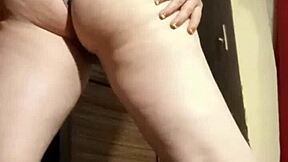 Camgirl slips into grey outfit for intimate ass play session.