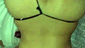 A young couple enjoys intimate bedroom moments together.