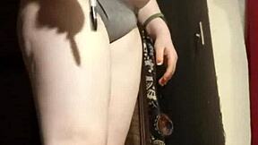 Camgirl slips into grey outfit for intimate ass play session.