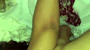 A young couple enjoys intimate bedroom moments together.