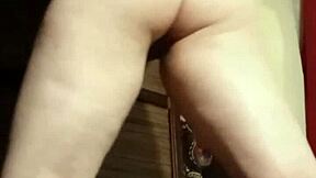 Camgirl slips into grey outfit for intimate ass play session.