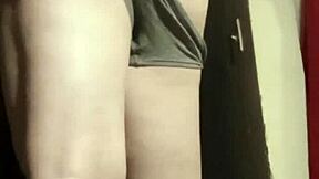 Camgirl slips into grey outfit for intimate ass play session.