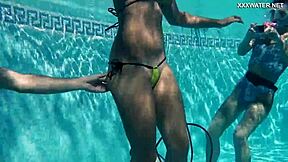 Petite teens Candy and Lizzy fuck Mike hard underwater