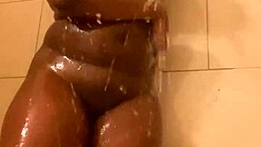 young ebony slips into shower revealing tight wet goods backstage