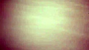 A young couple enjoys intimate bedroom moments together.