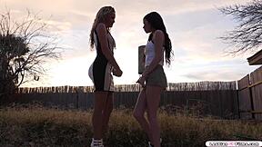 Milf grinds wet pussy on brunette's huge tits while fingering deep.