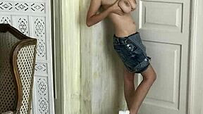 hot brunette with big natural tits long hair and tattoos strips bra in sexy underwear photoshoot session