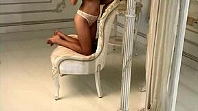 hot brunette with big natural tits long hair and tattoos strips bra in sexy underwear photoshoot session