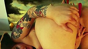 harley quinn cosplay babe stretches ass cheeks with giant dildo toy