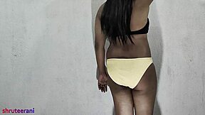 Indian shemale crossdresses in lime bikini for solo ass play