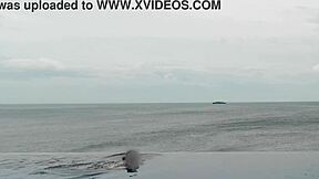 skinny japanese girl chills by infinity pool