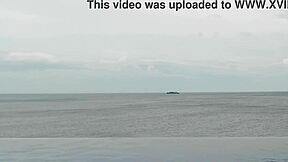 skinny japanese girl chills by infinity pool